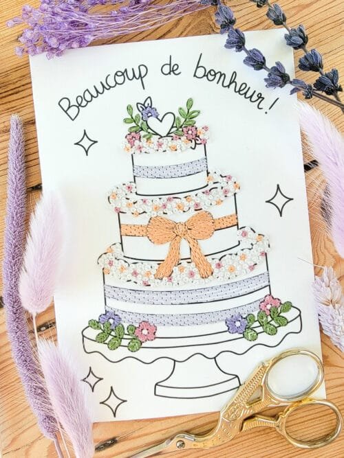 Exemple brodé d'une carte d'un gateau de mariés pour célébrer un mariage